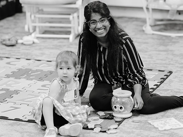 Woman with child playing on floor Woman with child playing on floor
