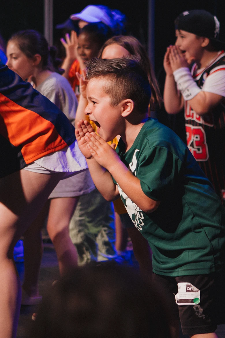Group of girls sitting on grass smiling Group of girls sitting on grass smiling