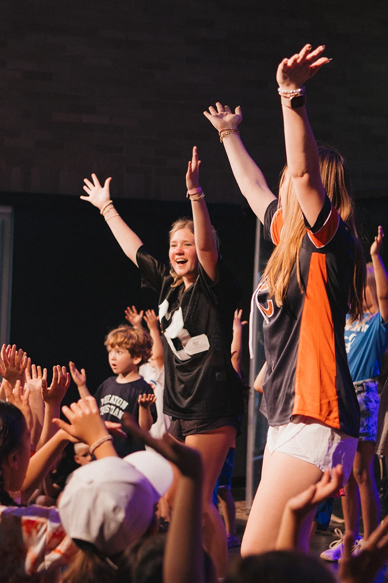 Group of girls sitting on grass smiling Group of girls sitting on grass smiling