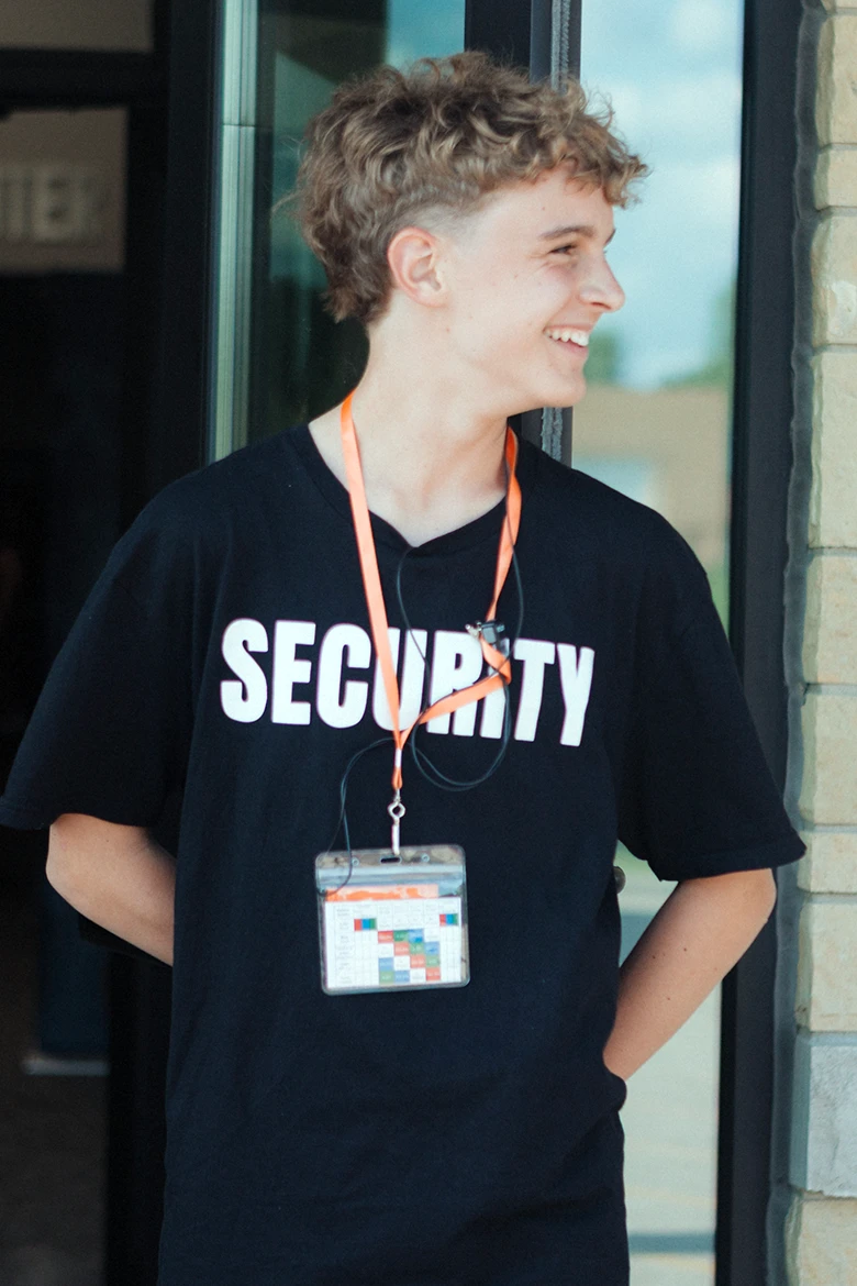 Group of girls sitting on grass smiling Group of girls sitting on grass smiling