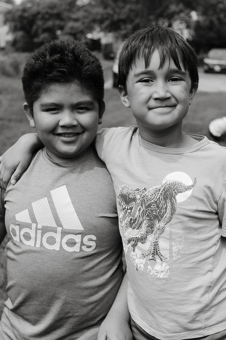 Group of girls sitting on grass smiling Group of girls sitting on grass smiling